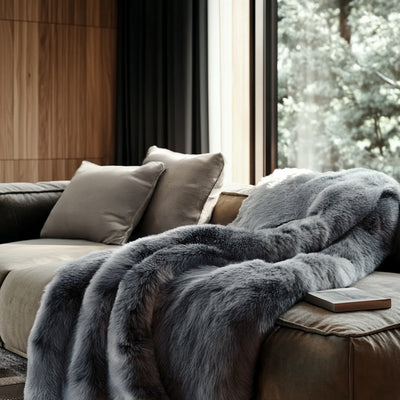 Faux fur luxury bedding blanket styled in modern bedroom
