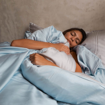 Close-up of eucalyptus-inspired bedding fabric showing soft breathable cooling texture detail